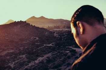 Man Standing Near Mountain Peak