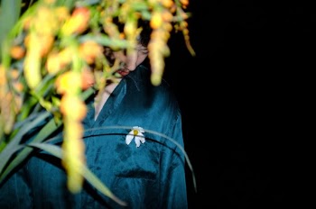 Man Standing Near Plants
