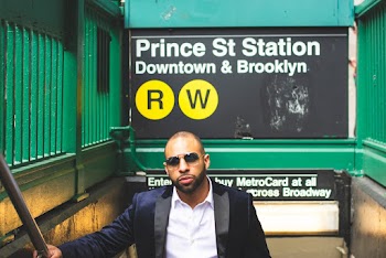 Man Standing Near Prince St Station Sign