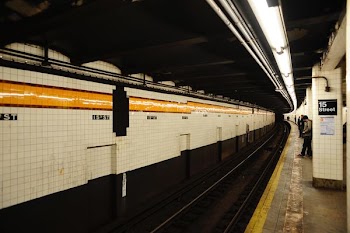 man standing near railway