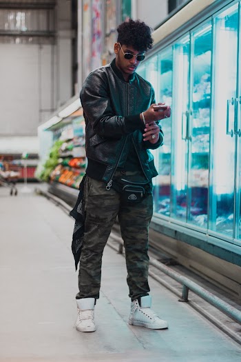 Man Standing Near Refrigerator