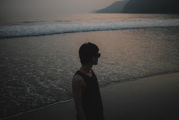 Man Standing Near Shore