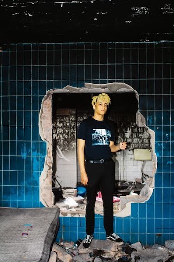 Man Standing Near Wall