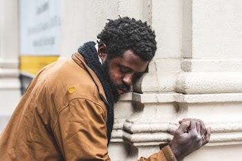 Man Standing Near Wall