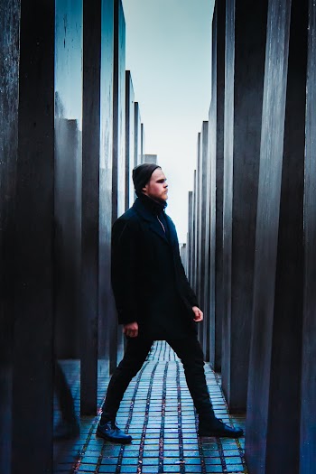 Man Standing Near Walls