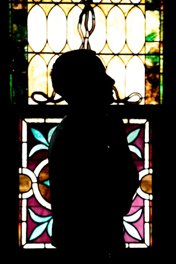 Man Standing Near Window