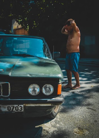 Man Standing Nearby Car