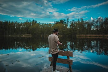 Man Standing on a Dock