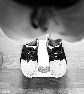 Man standing on a scale | Free stock photo - 413541