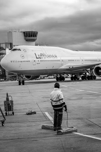 Man Standing on Airliner Road