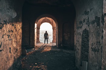 Man Standing On Arc Doorway
