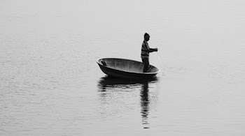 Man Standing on Boat