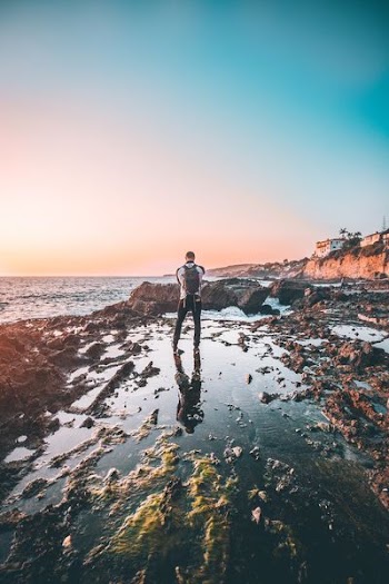 man standing on body of water