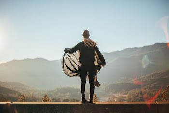 man standing on brown concrete surface