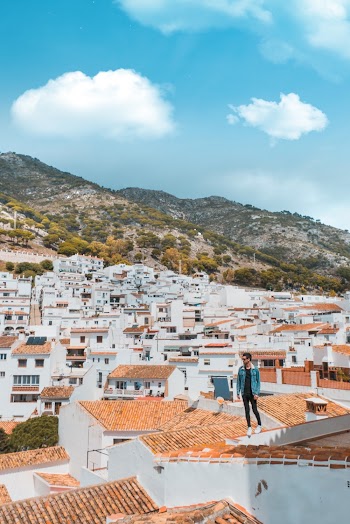 Man Standing on Brown House Roofing