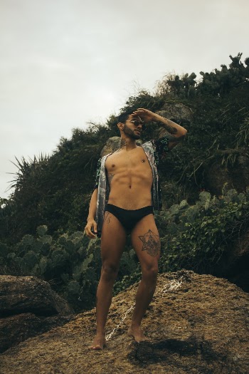 Man Standing on Brown Sand