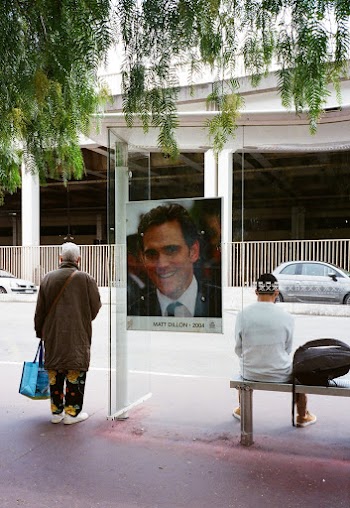 Man Standing on Bus Stop