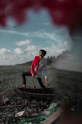 Man Standing on Canoe