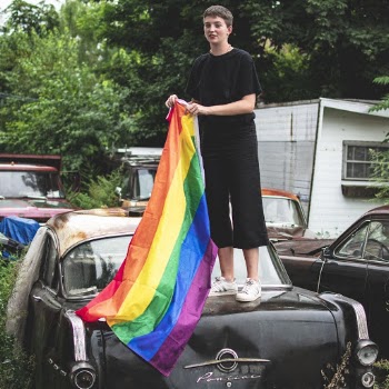 Man Standing on Car