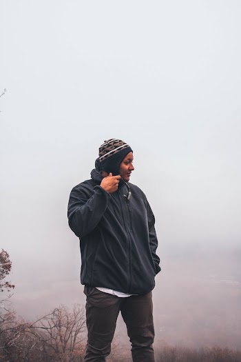Man Standing on Cliff