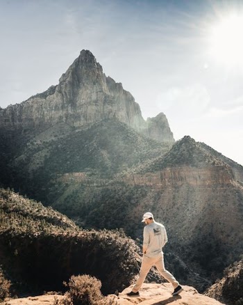 man standing on cliff