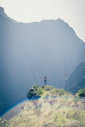 Man Standing on Cliff