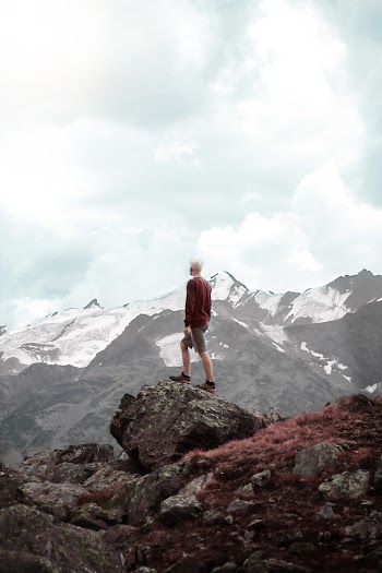 Man Standing on Cliff