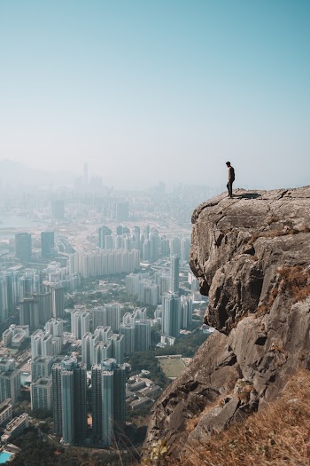 Man Standing on Cliff