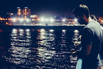Man Standing on Deck