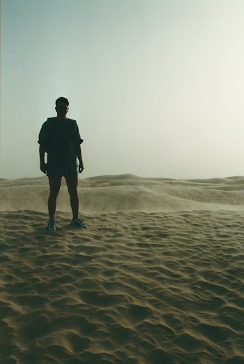 Man Standing on Dessert Area