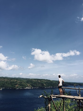 Man Standing on Dock