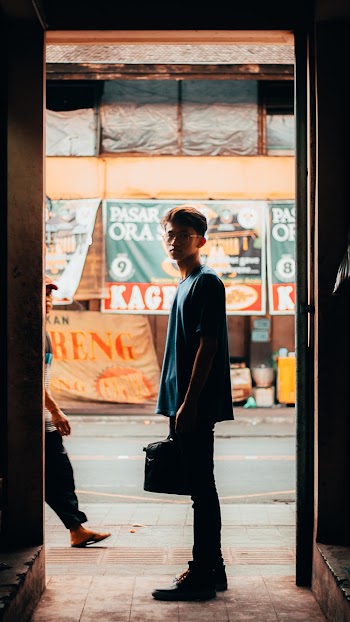 Man Standing on Doorway