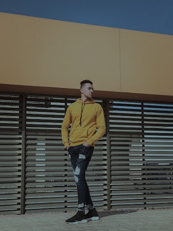 Man Standing on Floor Beside Wall
