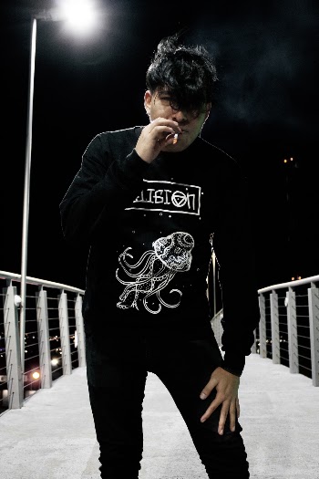 Man Standing on Footbridge