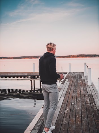 Man Standing on Footbridge