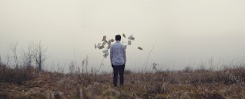 man standing on grass
