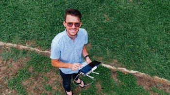 Man Standing on Grass