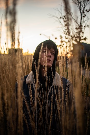 Man Standing on Grass