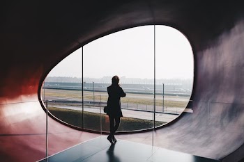 man standing on gray platform