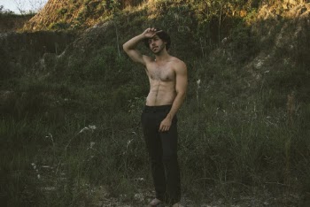Man Standing On Green Grass
