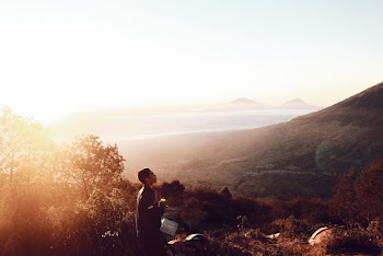Man Standing on Hill