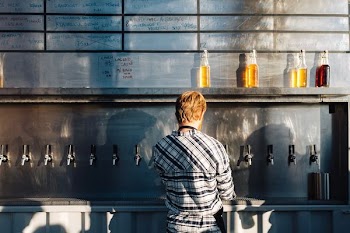 man standing on kitchen sink