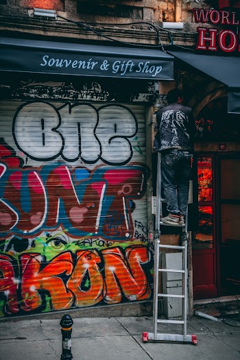 Man Standing On Ladder
