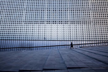 Man Standing on Modern Office Building