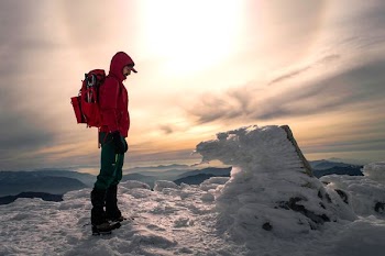 man standing on mountain