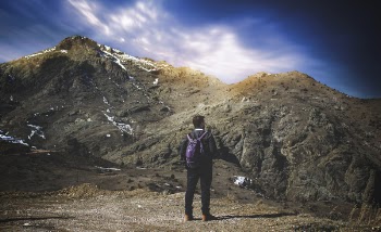 Man Standing on Mountain