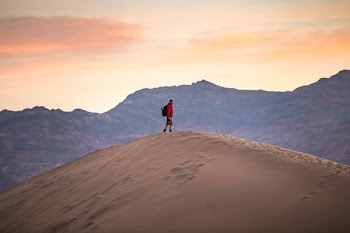 man standing on mountain