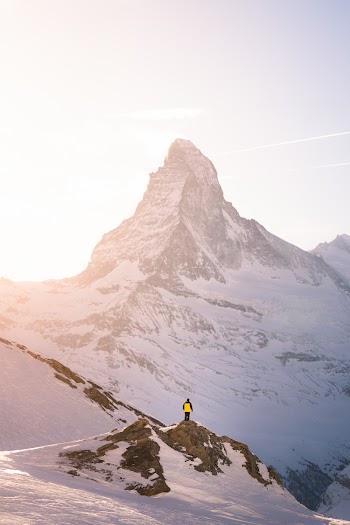 Man Standing On Mountain