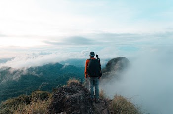 Man Standing on Mountain