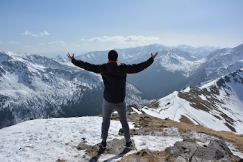 Man Standing on Mountain